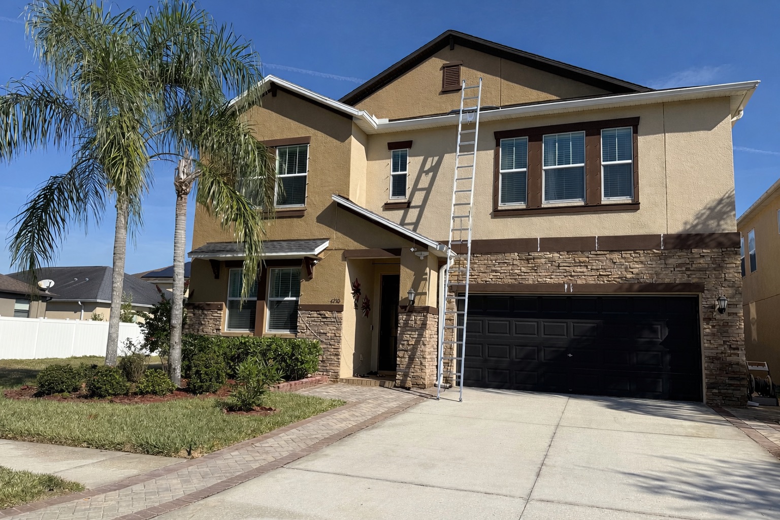 Two-story home before exterior painting Tampa - Premier Contractors FL