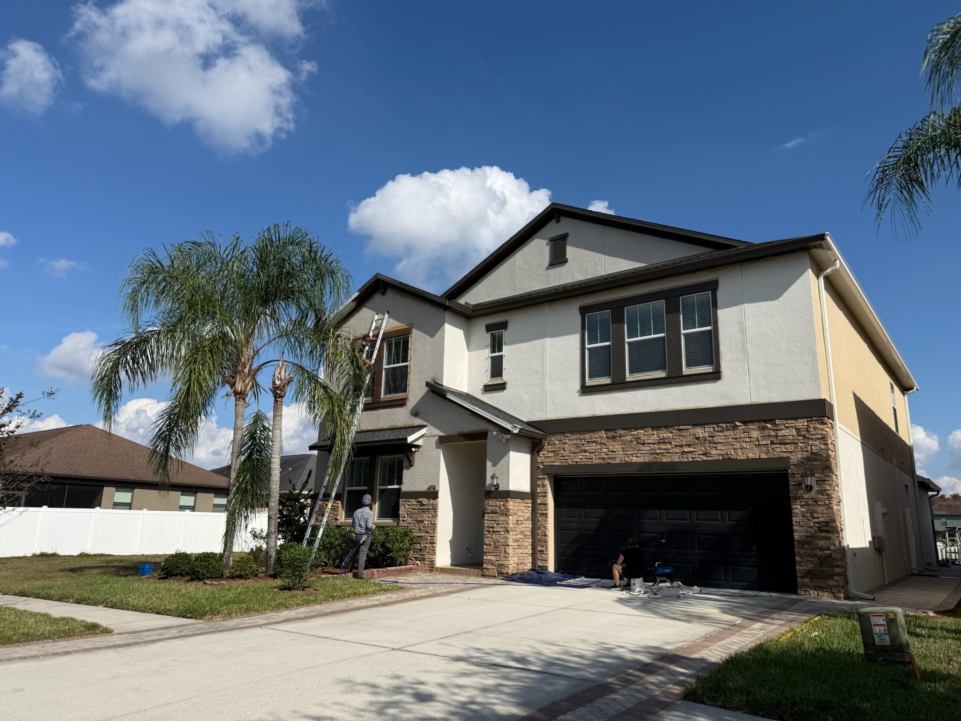 Two-story exterior painting in progress Tampa - Premier Contractors FL